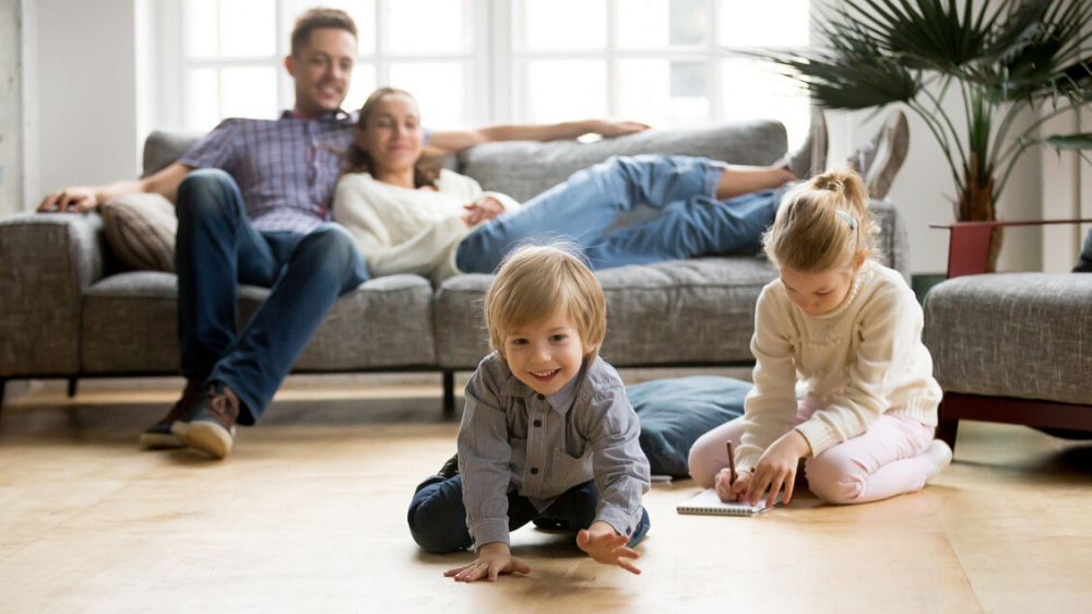 A family relaxing in their home, knowing they are being professionally monitored 24/7 for fire and smoke.