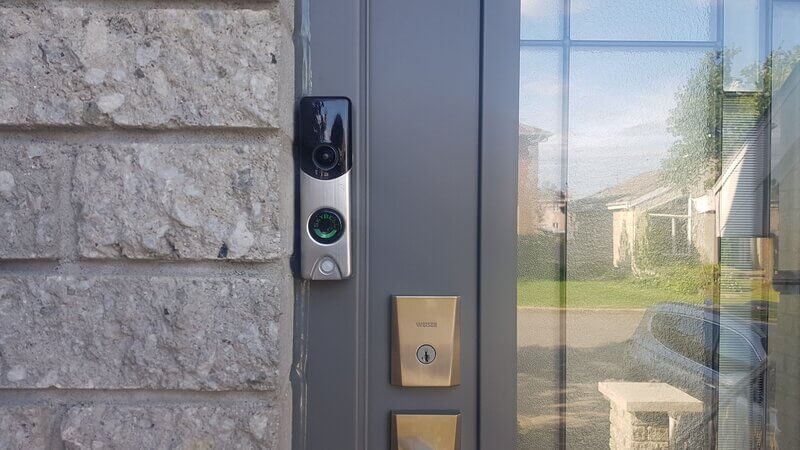 Smart video doorbell next to cottage door